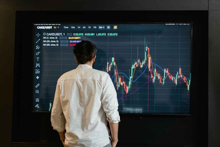 Trader analyzing chart patterns on screen - Backtesting Complete 7-Step Success Guide.