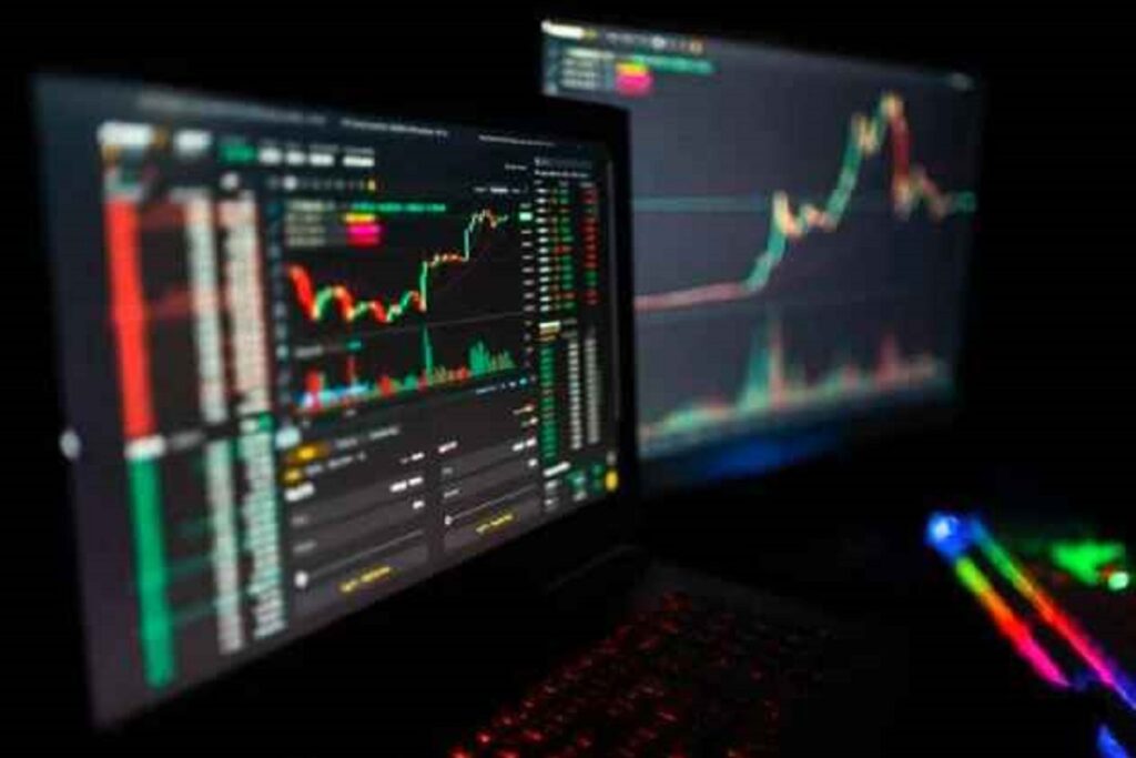 Learn Crypto Trading: Dark-themed trading dashboard displaying live cryptocurrency charts and real-time market data on dual monitors, ideal for crypto analysis.