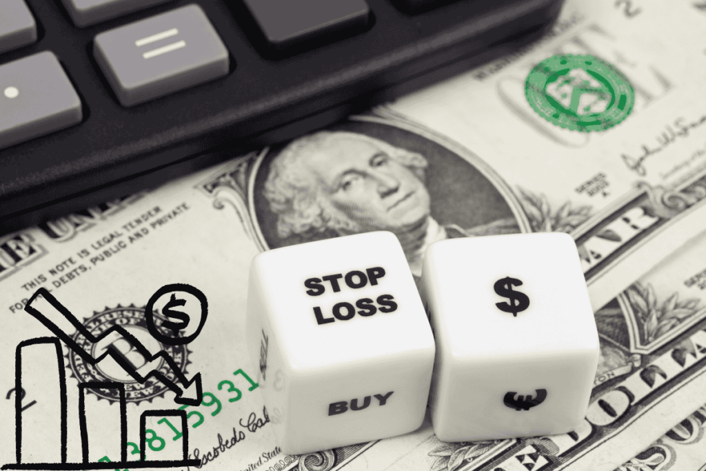 Stop-loss order concept is represented with dice showing 'stop loss' and a stock market downward trend graph placed on a dollar bill with a calculator nearby